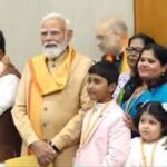 Newly elected BJP national president Nitin Nabin with his family members and PM Narendra Modi